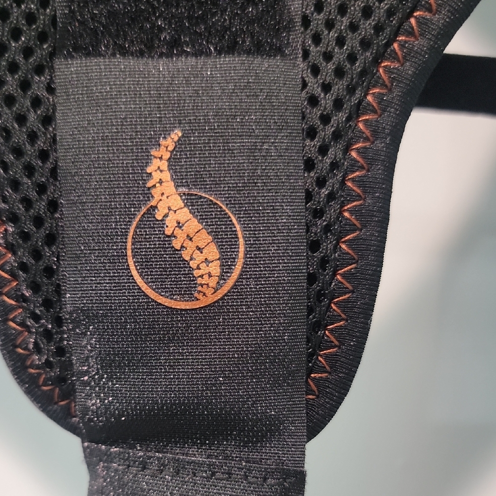 Source Unknown Black and Orange Back Support